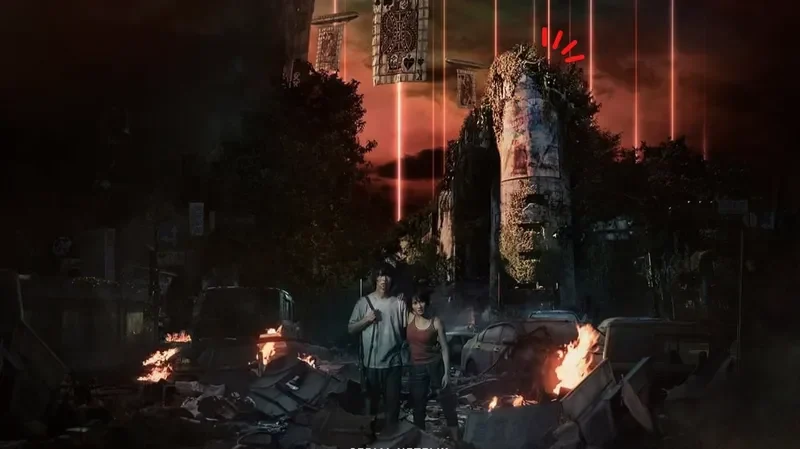 Arisu dan Usagi berjalan di reruntuhan kota dengan api menjulang dan laser merah.