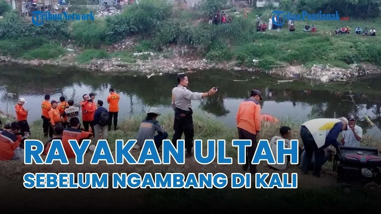 Tim penyelamat dan warga berada di tepi sungai pasca penemuan jenazah.