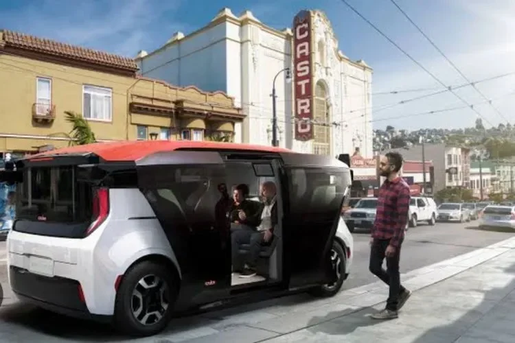 Robotaxi modern melayani penumpang di jalan perkotaan, mewujudkan mobilitas tanpa sopir.