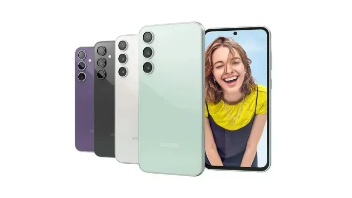 Ilustrasi beberapa varian warna iPhone terbaru dengan layar menyala menampilkan wajah tersenyum.